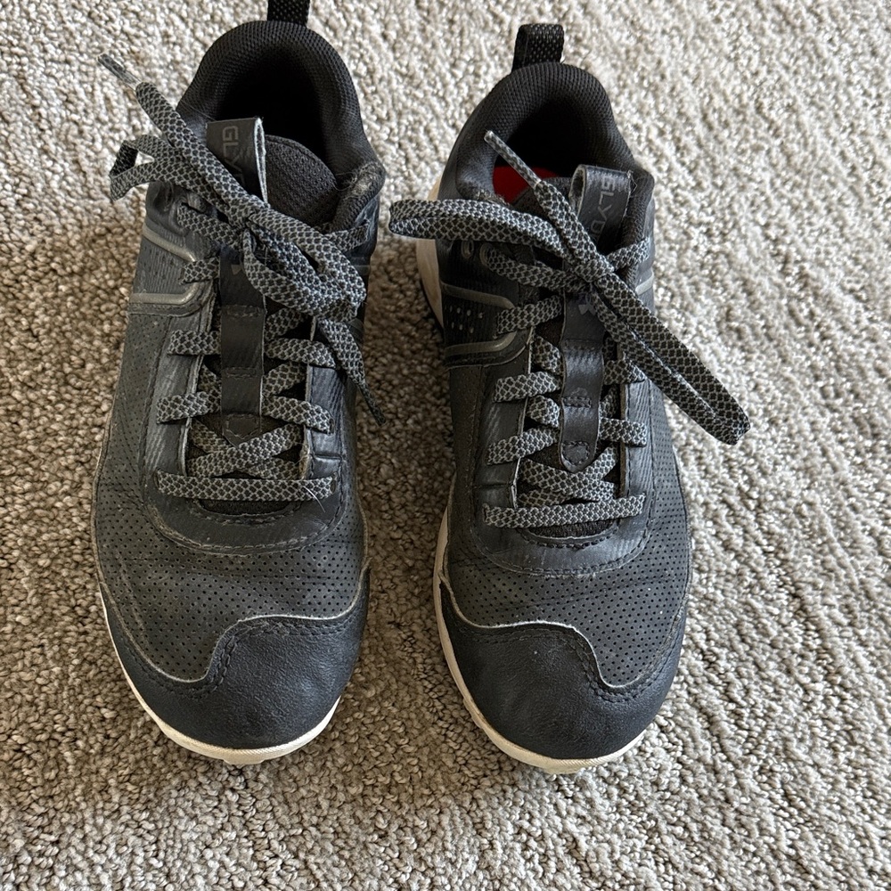 Girl’s/unisex Black Cleats UA softball soccer